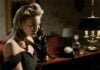 photo of woman in black off shoulder dress