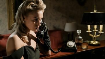 photo of woman in black off shoulder dress